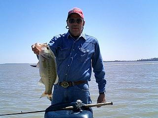 Mike Rhodes with a large Bass caught in the upper bay