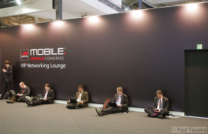 Visitors working at the Mobile World Congress 2011