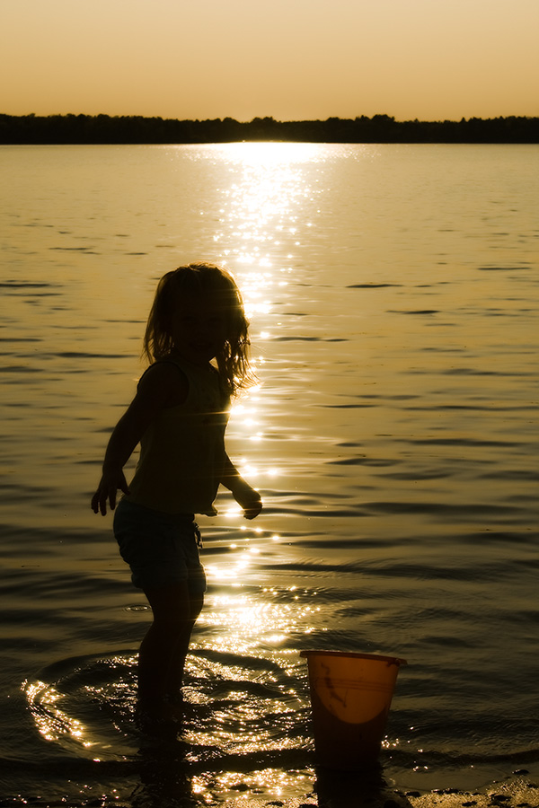 Caitlin playing at beach