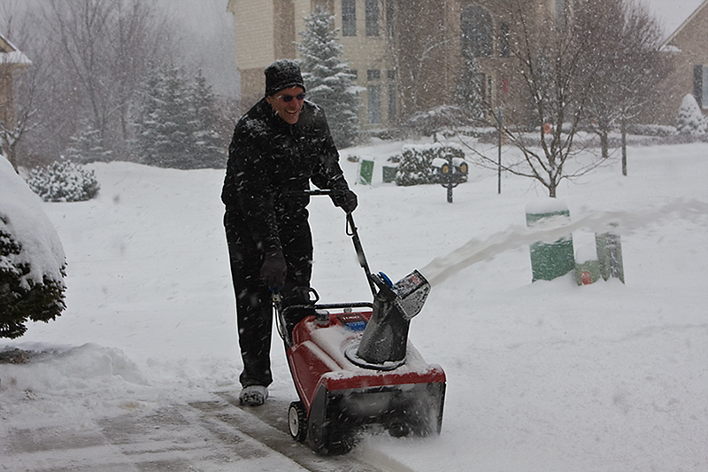 Still smiling and snowblowing!