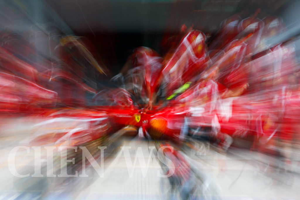 Ferraris crew practices pit-stop