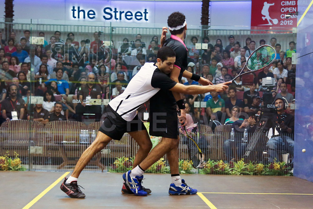 Mens final: Tarek Momen upset Mohamed El Shorbagy in a tensely fought match.