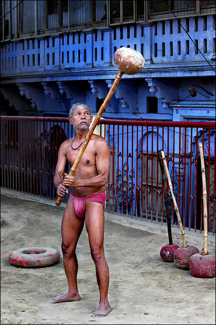 Swinging his bat