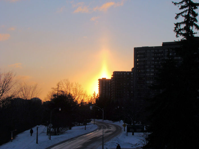 Sun pillar during a winter sunrise