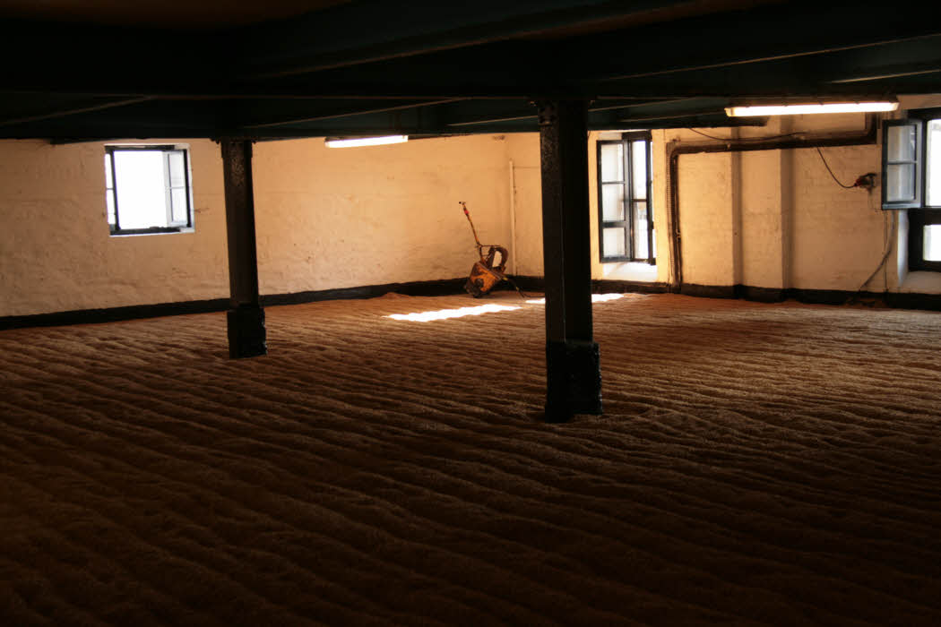 Inside the Bowmore Distillery - the malting hall where the barley is spread on the floor and allowed to germinate