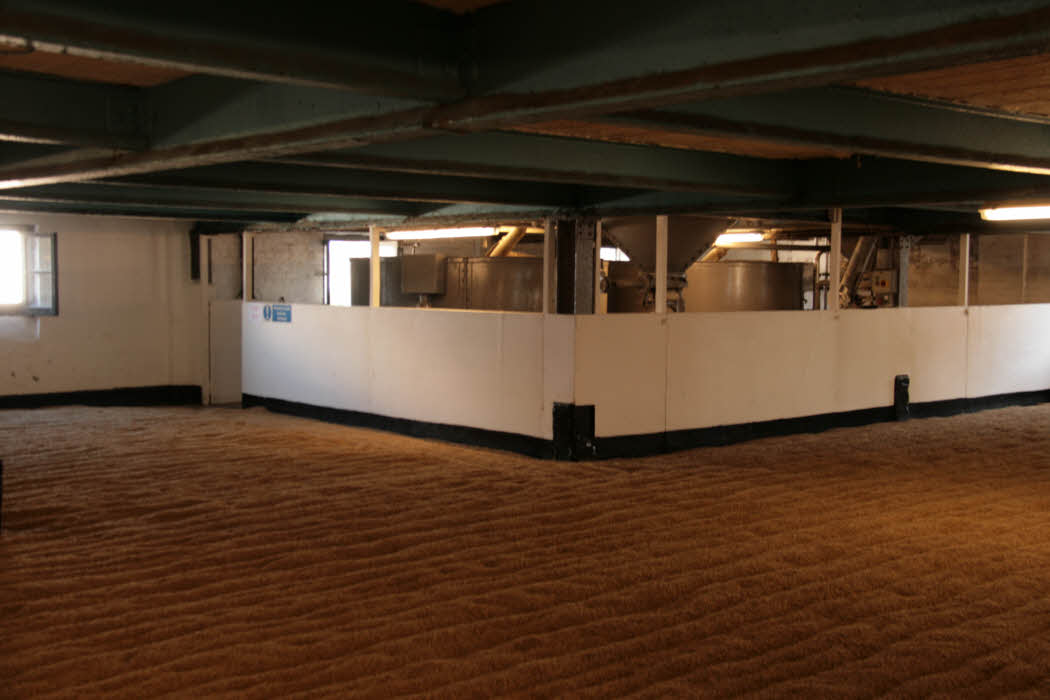 Inside the Bowmore Distillery - the malting hall where the barley is spread on the floor and allowed to germinate