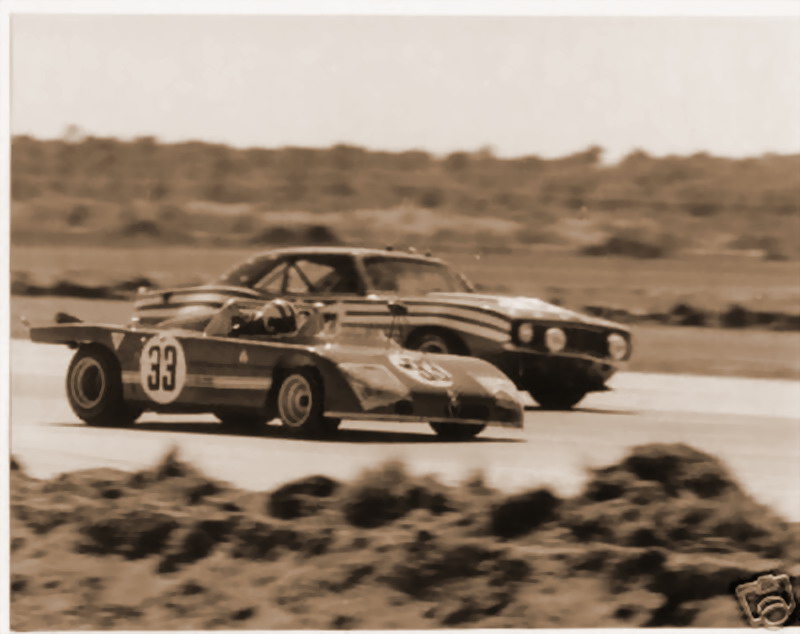 3rd Place Alfa Romeo 33TT3 of Vaccarella-Hezemans dwarfed by a Camara, 12Hrs Sebring 1972.jpg