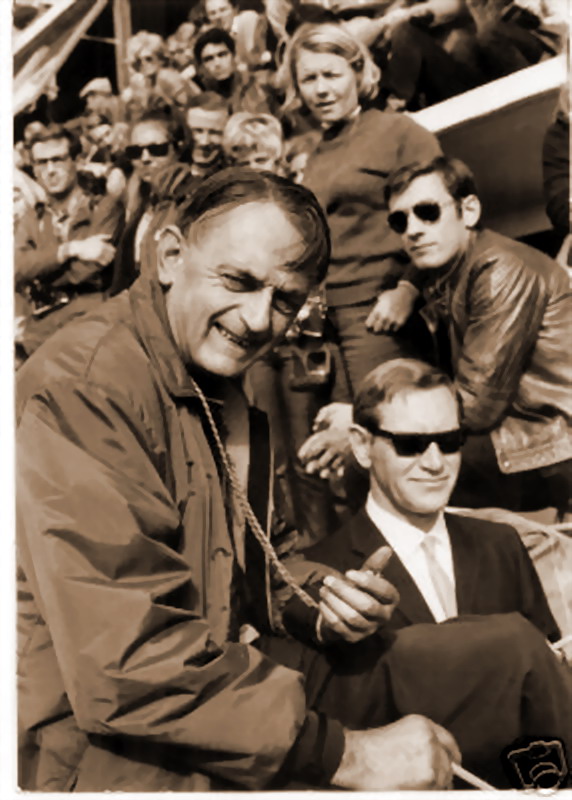 John Wyer with stopwatch in hand and Roy Lunn in the pits at Le Mans 1968 - Victory for the Wyer entered Fort GT40.jpg