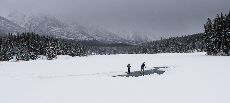 Ice skating couple, Johnson Lake, Banff