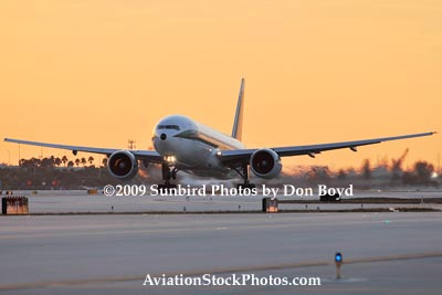 Alitalia B777-243/ER EI-DDH lifting off near sunset at Miami International Airport aviation stock photo #3266