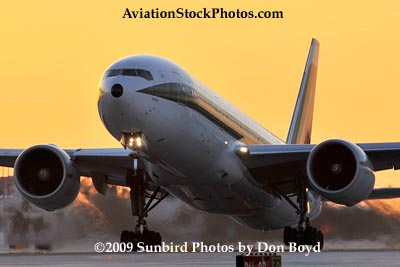 Alitalia B777-243/ER EI-DDH lifting off near sunset at Miami International Airport aviation stock photo #3267