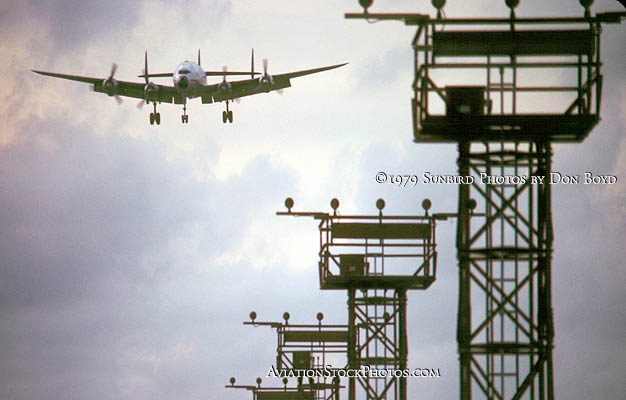 1979 - Lockheed L-749 Constellation N6021C on short final approach sunset aviation cargo airline stock photo #SS7901