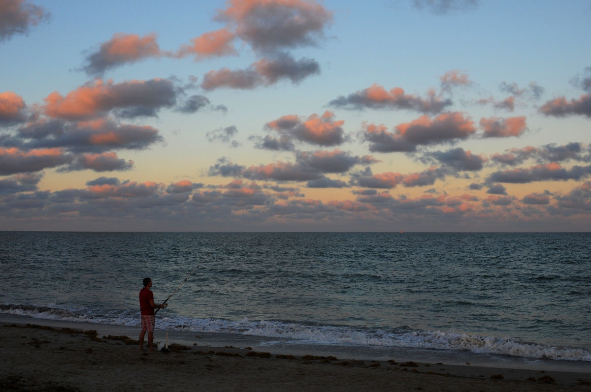 Fisherman trying his luck at sunset. 