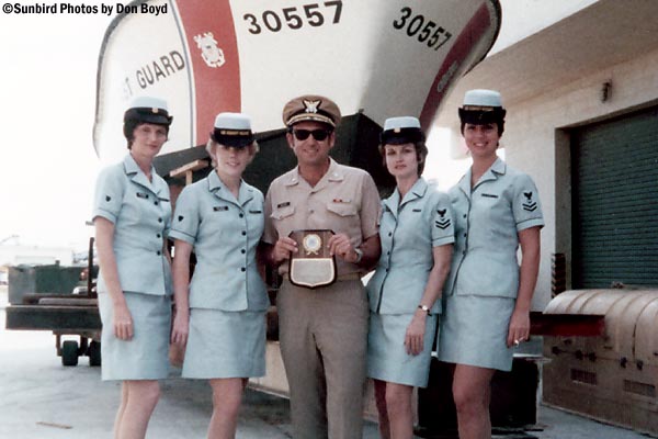 Mid 1970s - CDR Tom Vellanti displaying unit award with our unit ladies