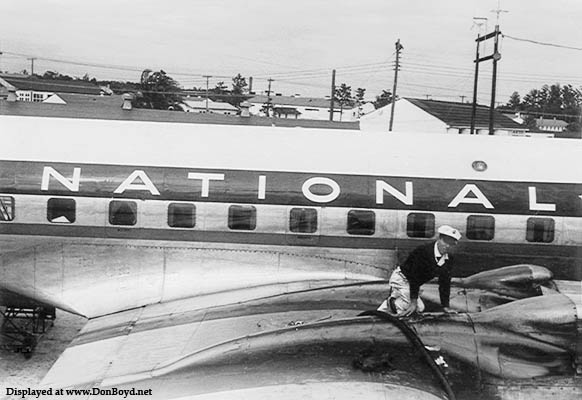 Early 1950s - a fueler servicing the oil on a National DC-6B
