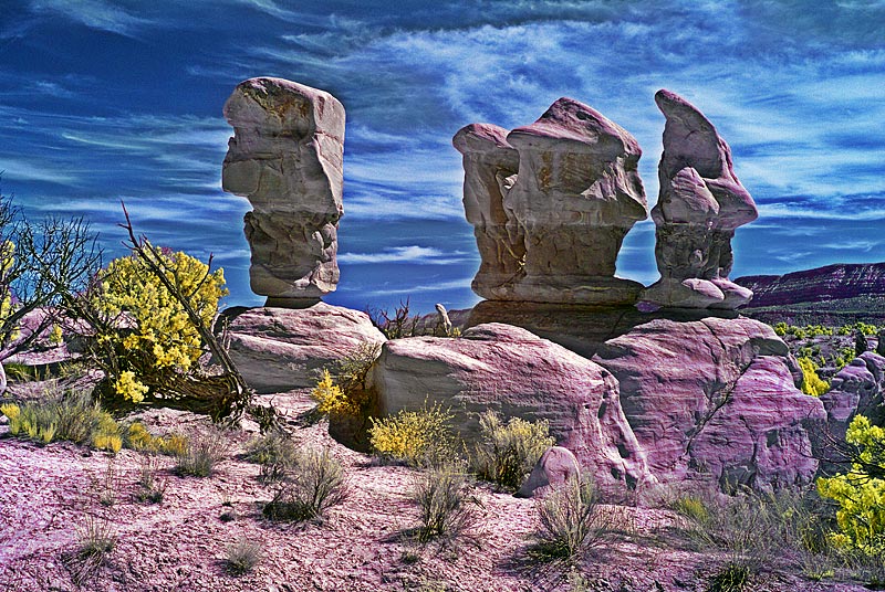 Original image with red and blue channels swapped, then hue/saturation adjusted in the blue and yellow channels. Next I used hue/saturation to make the rocks more magenta.
