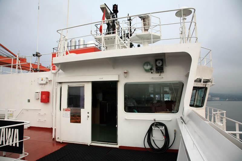 On starboard (right-hand side) bridge wing looking into wheelhouse