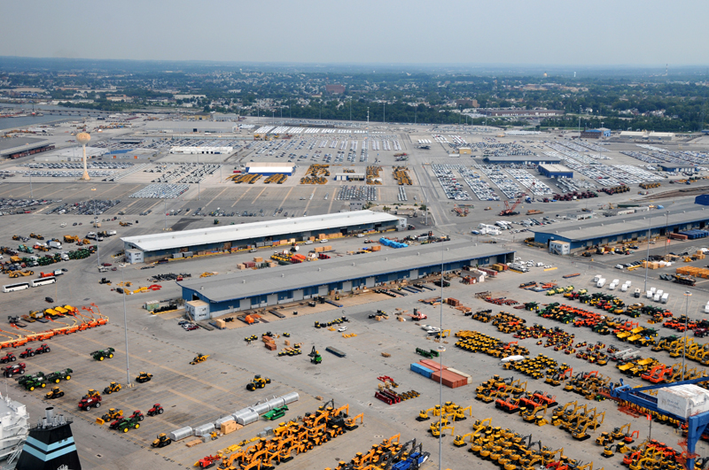 Construction/Earthmoving Equipment and other vehicles in large lot in Baltimore Harbor