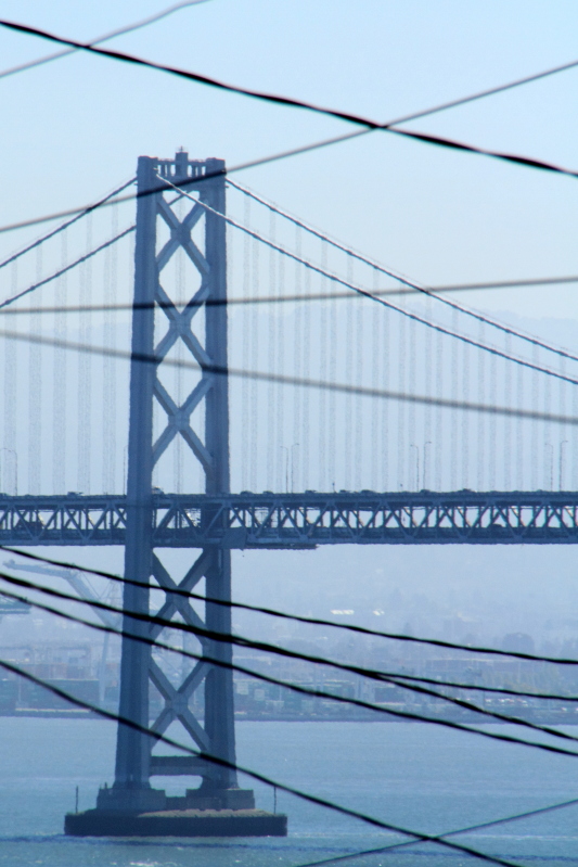 Bay Bridge, cable car and electric wires, San Francisco