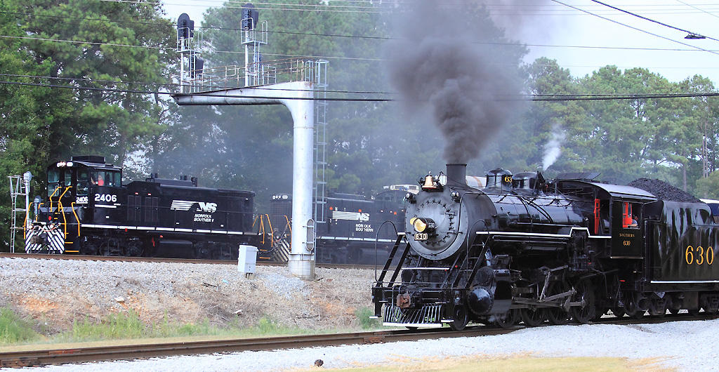 SR 630 is backing towards the NS mainline as the Volkswagen switcher passes by