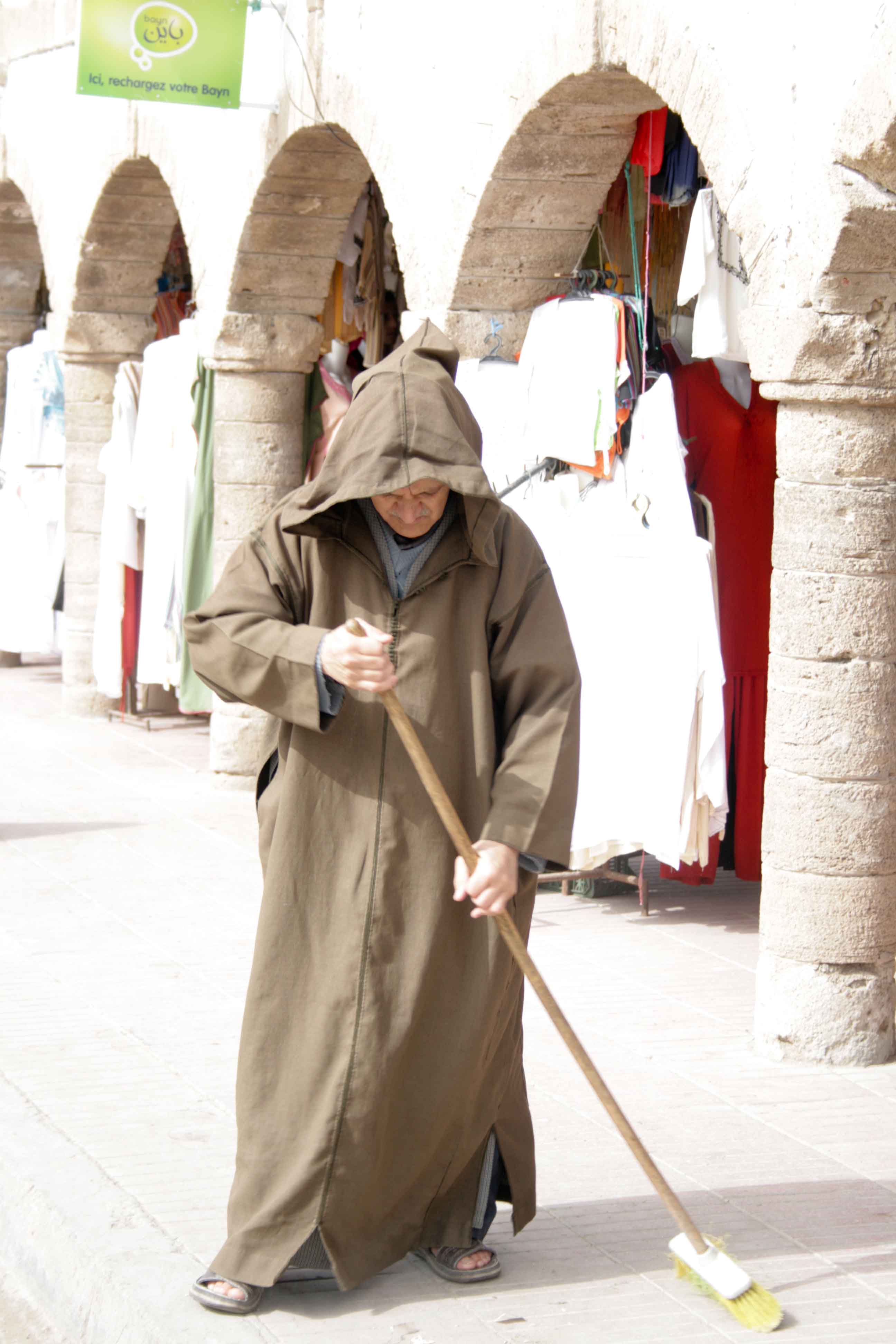 a man tidying up his stall