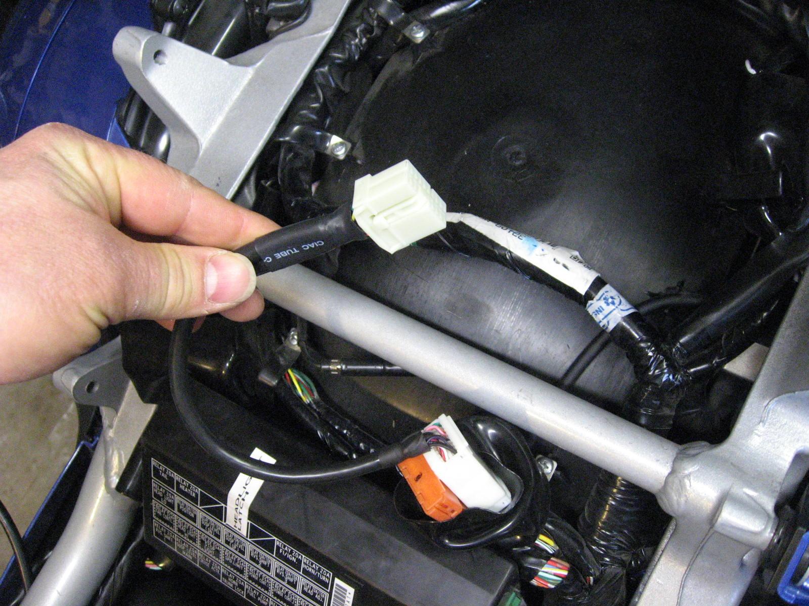 Pass through connector is for the optional CD changer if you have one