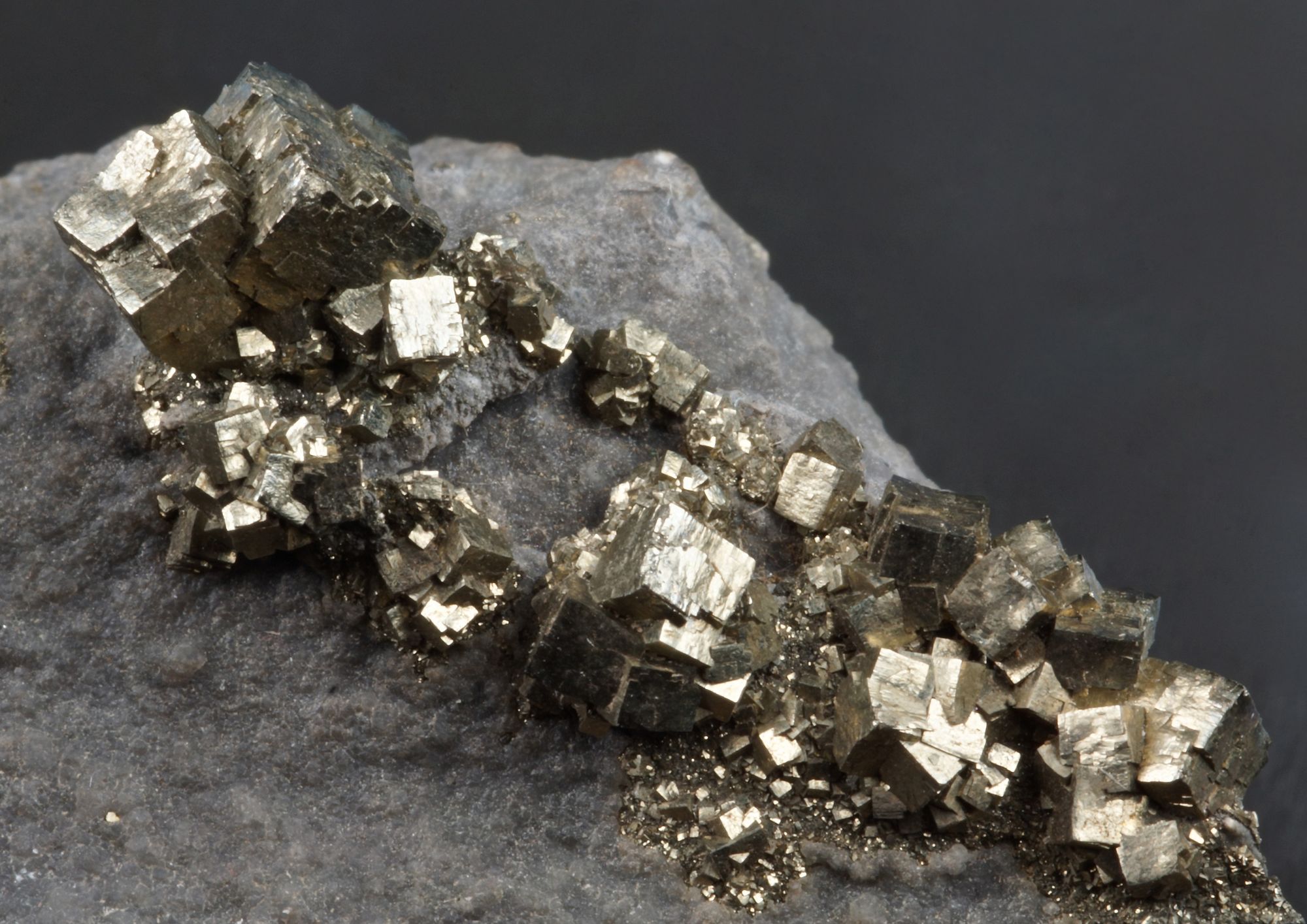 Group of pyrite cubes to 5 mm. Nenthead Mine, Alston Moor.
