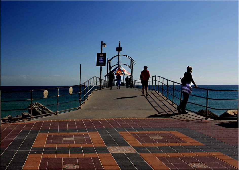 Looking at those walking up the jetty