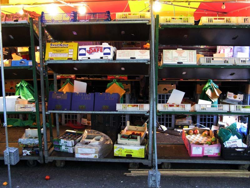 Hiding behind the street market stall
