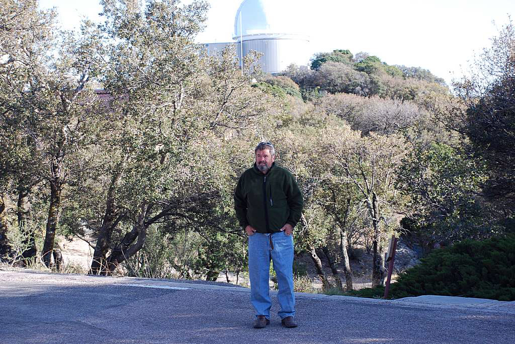 DON IN THE PARKING LOT WITH THE DOME OF THE 2.1 METER TELESCOPE IN THE BACKGROUND