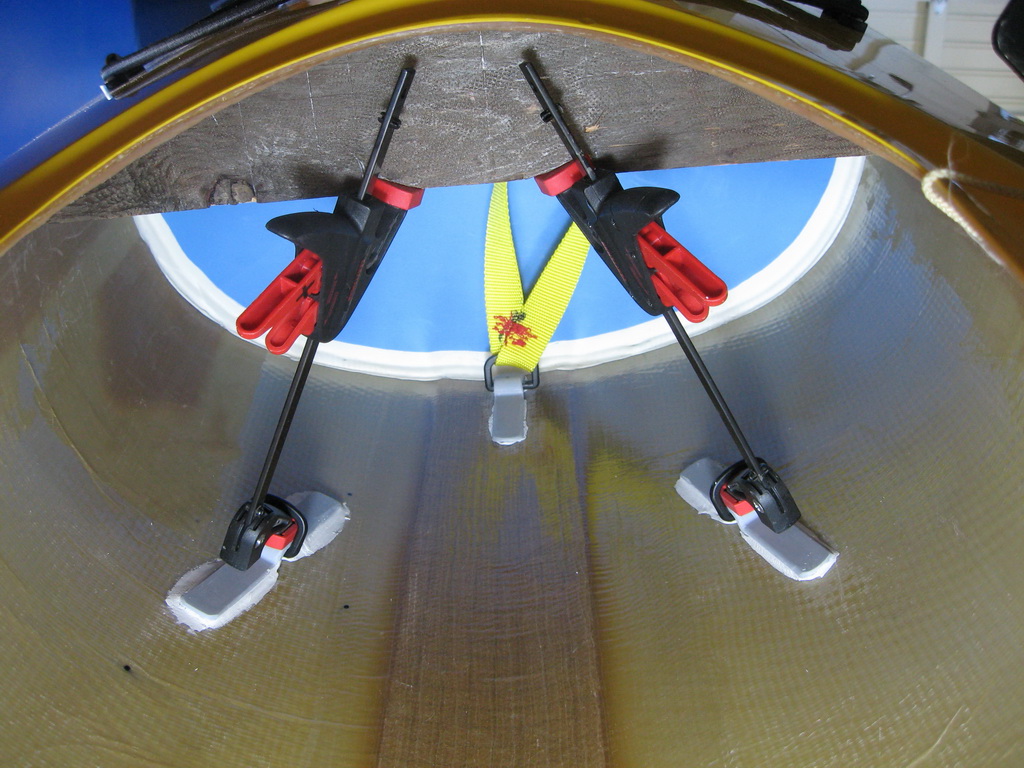 Anchors are PVC extrusions epoxied to the hull with Aquamend (aka PC-11?), a two-part putty that cures underwater.