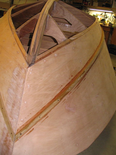 Spray rail guard, bow view. Couple placements into plywood pulled, demanding redos.