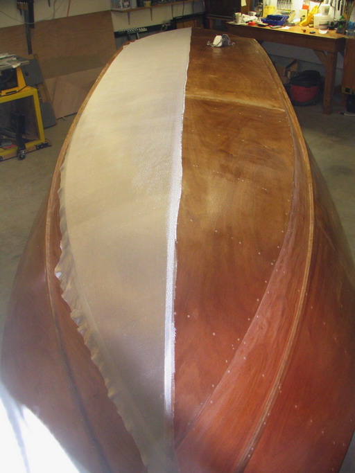 Glassing: resin allowed to soak in.  Squeegee drawn over glass to remove excess resin, for greatest strength.