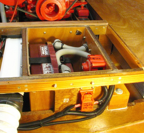 Battery box with added 40 A circuit, leading to helm.  Fused within 7 inches of battery, as required.