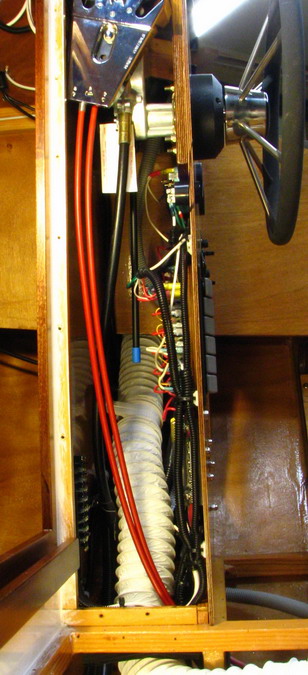 Port view of helm innards; rear panel falls back, for easier wire-up and service.  Succeeding photos: details inside helm