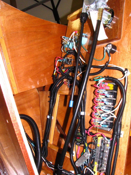 Side view of switch panel and bus bars: one: supply plus return/common ground point;, the other:  return/common ground point.