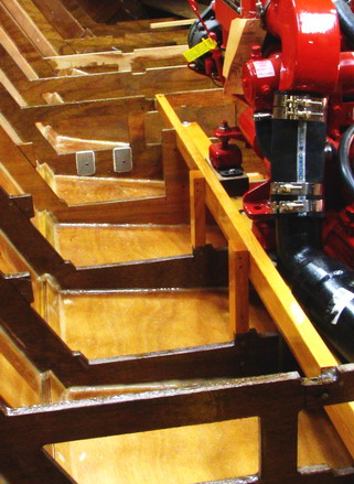 Port and star stringers anchored to frames 6-9 to support the inboard edges of floorboards.