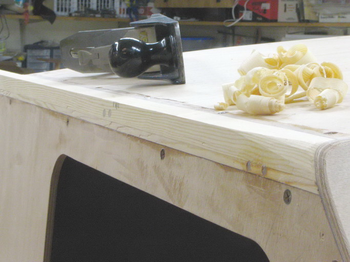 The sides get rounded forward of the eventual windshield location.  I love making shavings.
