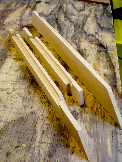 Windshield time: 1-inch fir stock, lap jointed; corner windows pieces.  Lotta compound angle miter cuts.