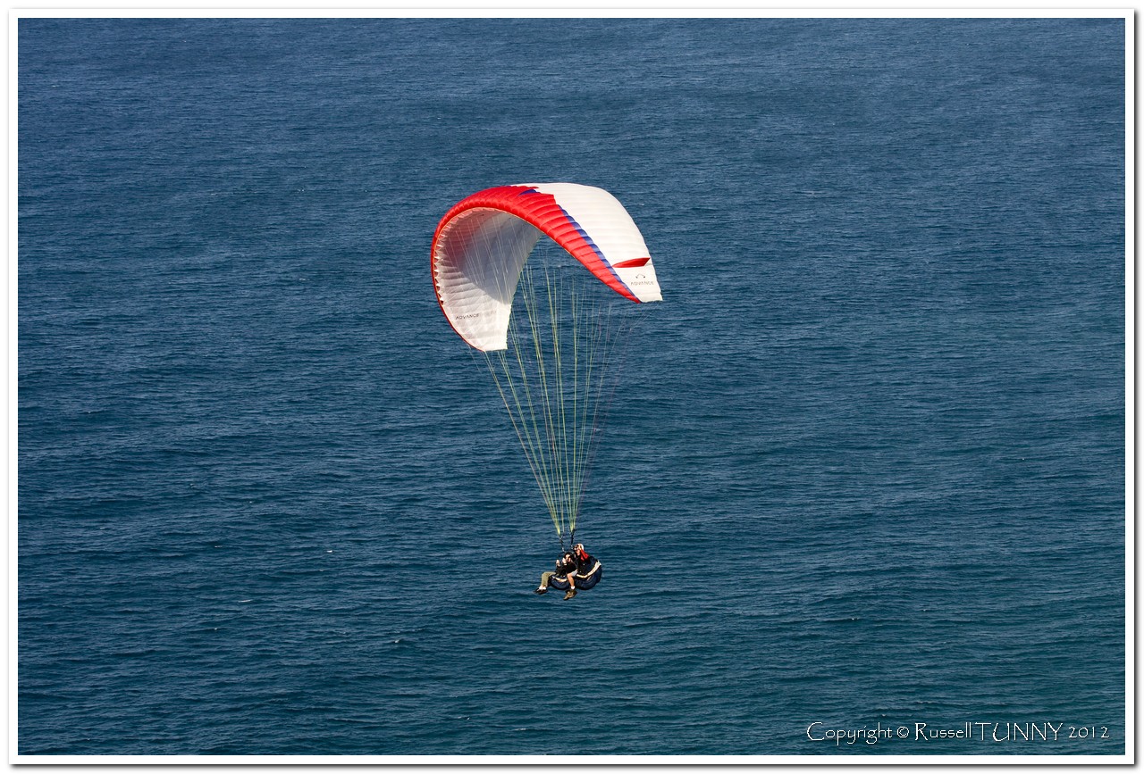 Parasailing over pacific ocean
