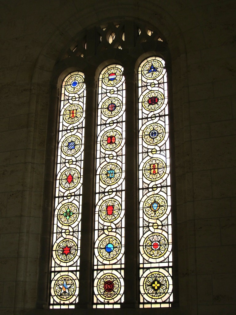 stained glass windows include the insignia of the divisions (the 29th is at center, second row from the bottom)