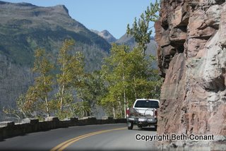 See how close to the rock the vehicles move? Yikes!