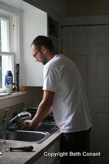 Ronnie washes the dishes.