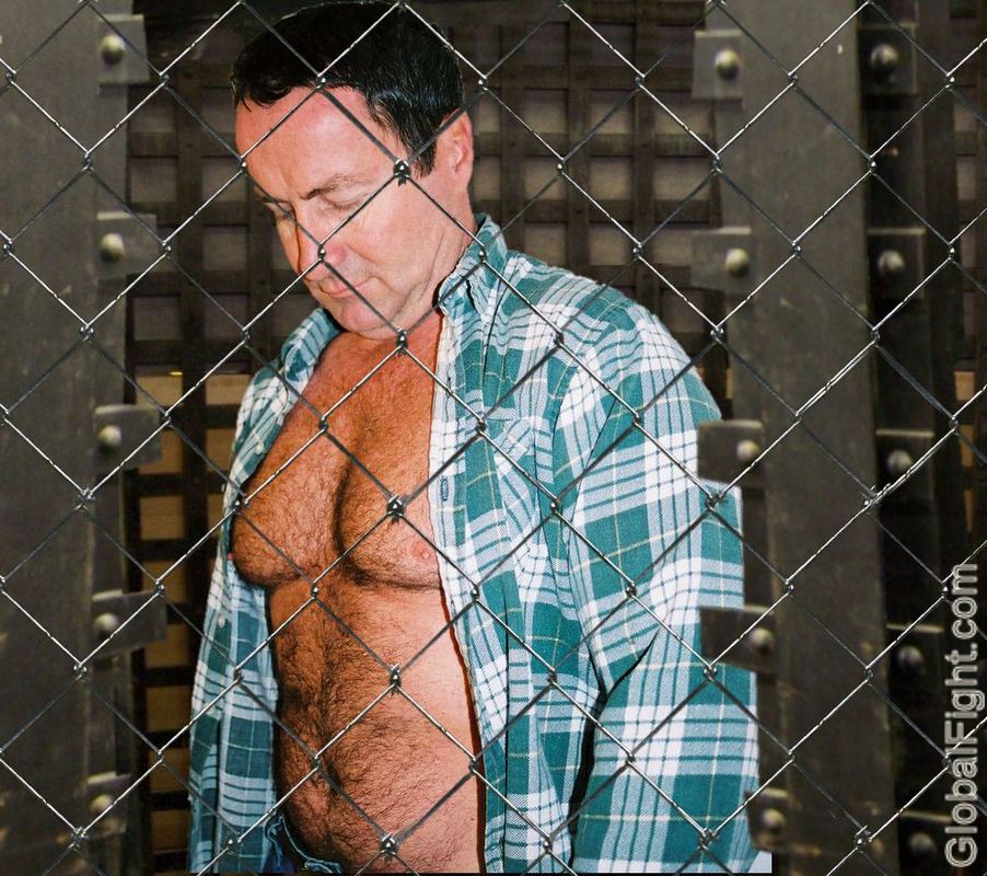 caged chained guys prisoners.jpg