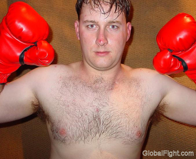 young boxing stud flexing arms.jpg
