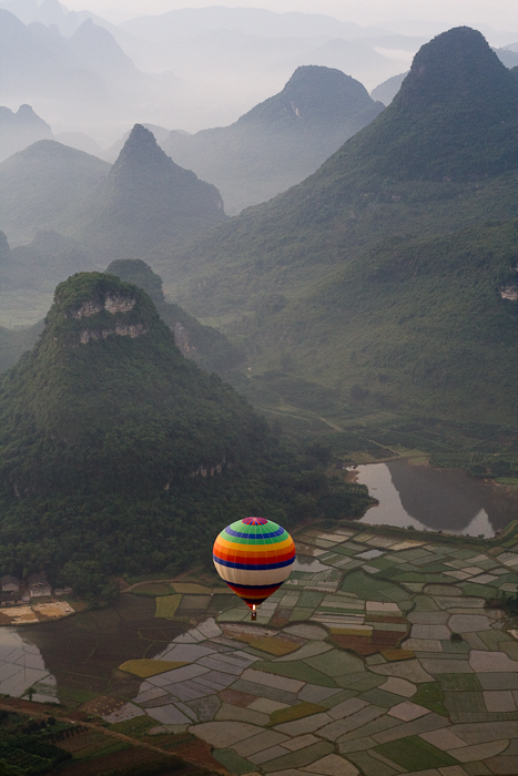 Hot air balloon above the Karst mountains