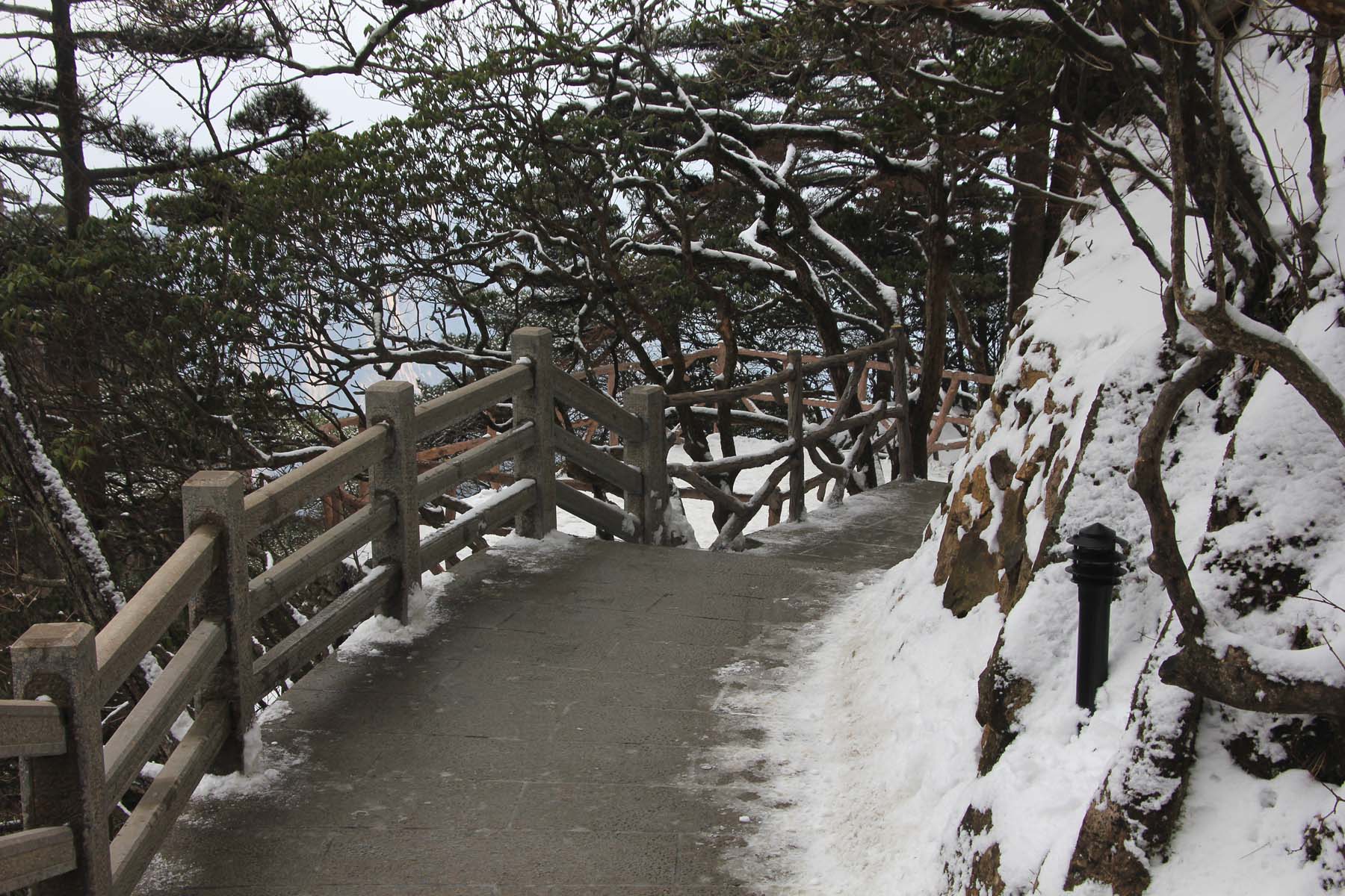 I hung on to the railing on this slippery trail down.