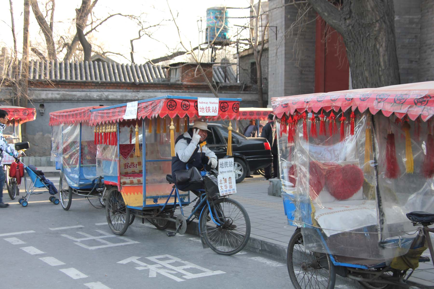 Rickshaws for hire on a Beijing street.