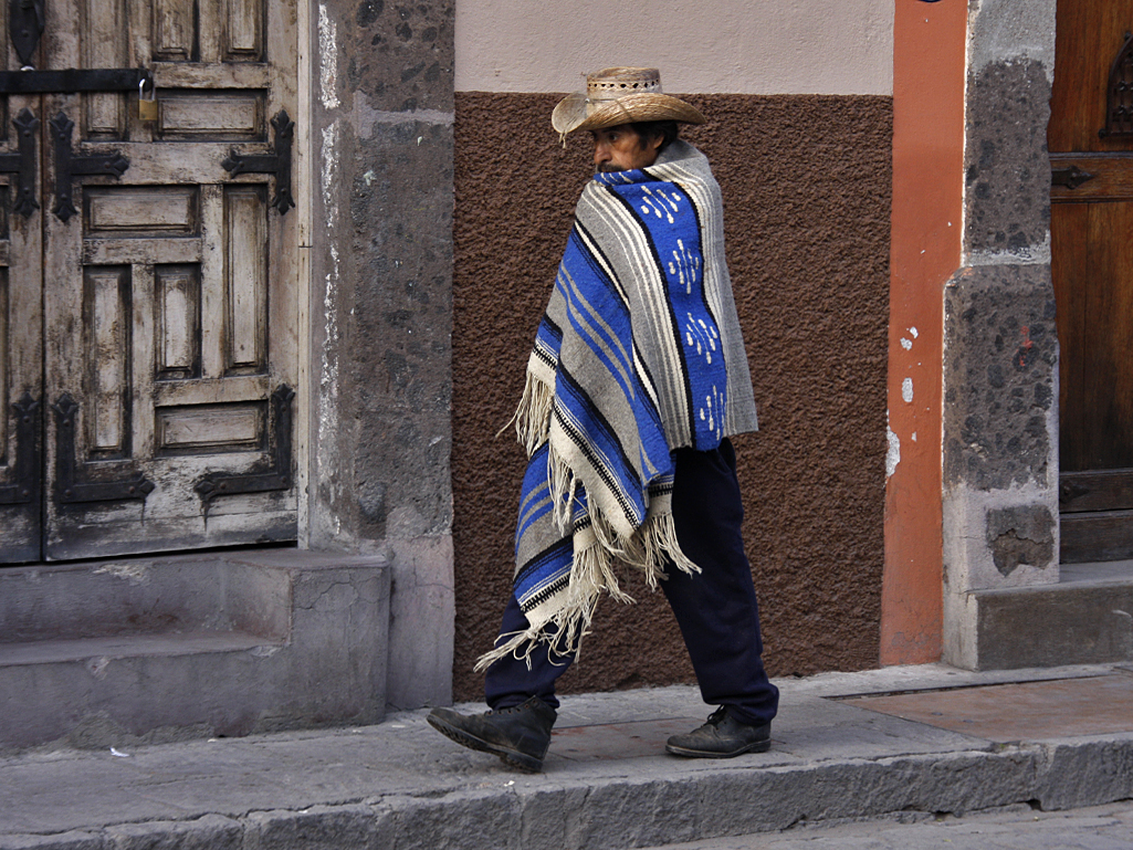 Poncho Man Walking Street