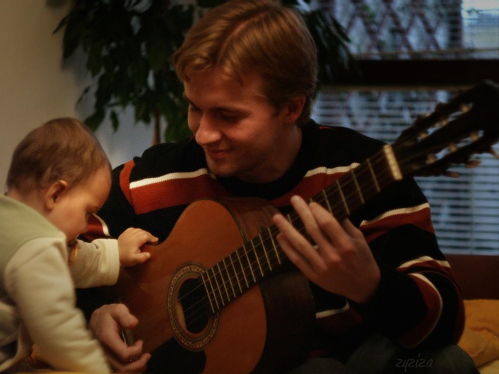 Amelka play quitar with her father